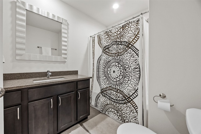 1221 Ronald Way, North Liberty, IA 52317 - full bath with toilet, vanity, and curtained shower