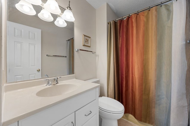 6909 Kent Dr NE, Cedar Rapids, IA 52402 - full bath featuring vanity, toilet, and a textured ceiling