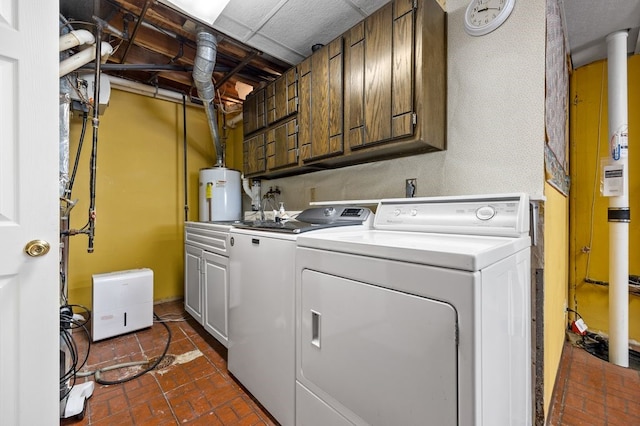 6909 Kent Dr NE, Cedar Rapids, IA 52402 - laundry room with cabinet space, washer and clothes dryer, water heater, and brick floors