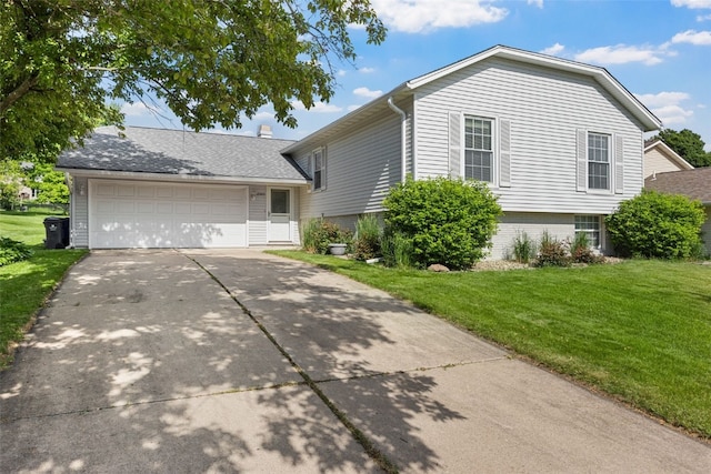 6909 Kent Dr NE, Cedar Rapids, IA 52402 - tri-level home featuring a front lawn, concrete driveway, and an attached garage