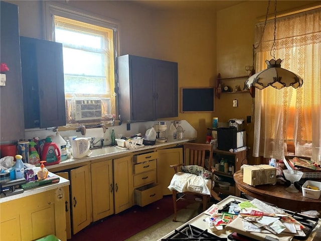 321 E 2nd St, Washington, IA 52353 - kitchen featuring light countertops, cooling unit, and a sink