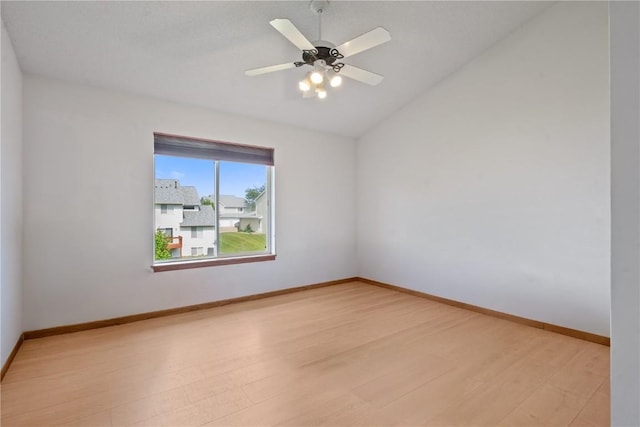 2710 Pheasant Ridge Ct, Marion, IA 52302 - empty room with light wood-style floors, vaulted ceiling, baseboards, and a ceiling fan