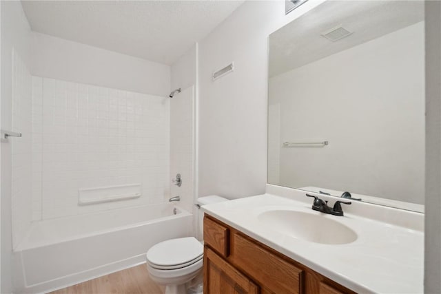 2710 Pheasant Ridge Ct, Marion, IA 52302 - full bathroom with vanity, toilet, wood finished floors, and bathtub / shower combination