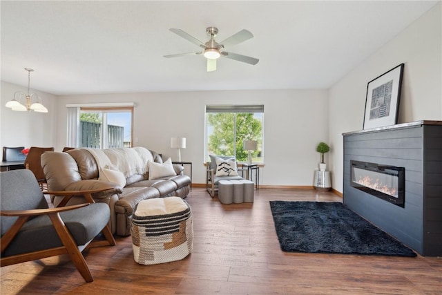2710 Pheasant Ridge Ct, Marion, IA 52302 - living area with plenty of natural light, a glass covered fireplace, and wood finished floors