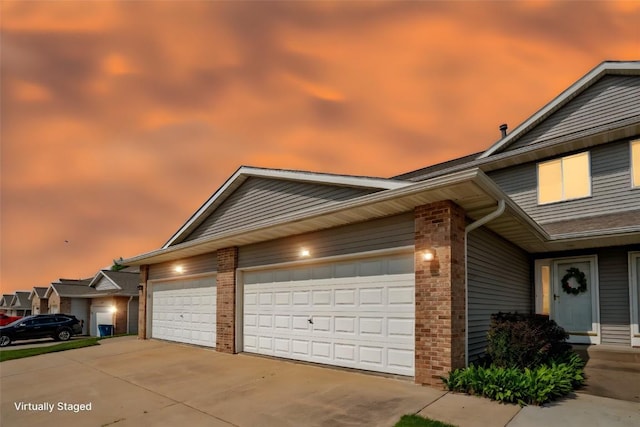 2710 Pheasant Ridge Ct, Marion, IA 52302 - view of front of house with brick siding, concrete driveway, and a garage