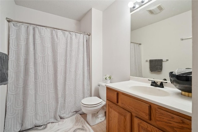 2710 Pheasant Ridge Ct, Marion, IA 52302 - bathroom with toilet, vanity, curtained shower, and wood finished floors