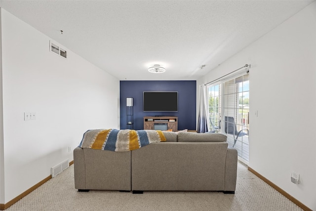 3511 E Ave NW Unit D, Cedar Rapids, IA 52405 - living area featuring baseboards and light carpet