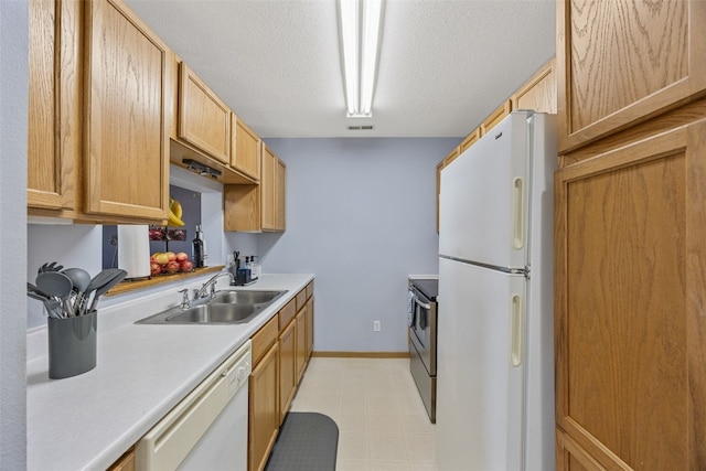 3511 E Ave NW Unit D, Cedar Rapids, IA 52405 - kitchen featuring white appliances, a sink, light countertops, light floors, and baseboards