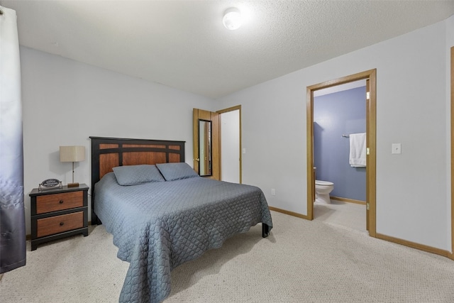 3511 E Ave NW Unit D, Cedar Rapids, IA 52405 - carpeted bedroom featuring baseboards and ensuite bathroom