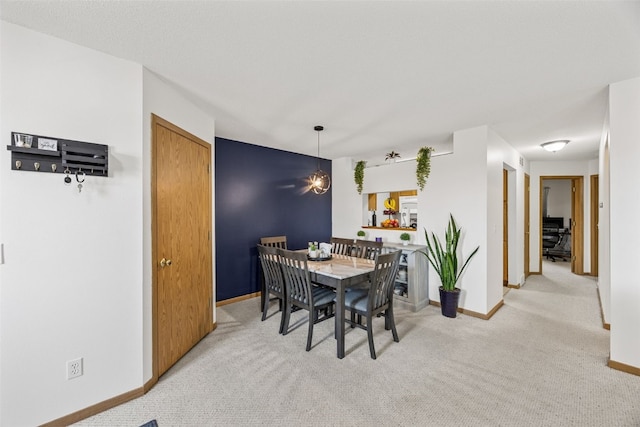 3511 E Ave NW Unit D, Cedar Rapids, IA 52405 - carpeted dining room with baseboards