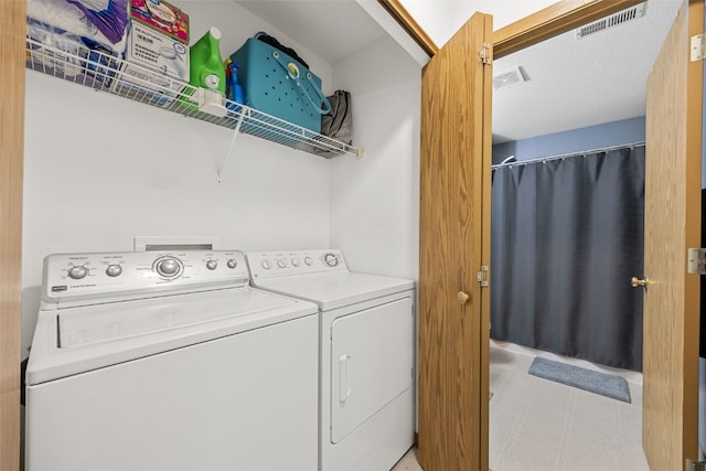 3511 E Ave NW Unit D, Cedar Rapids, IA 52405 - laundry area with washer and clothes dryer