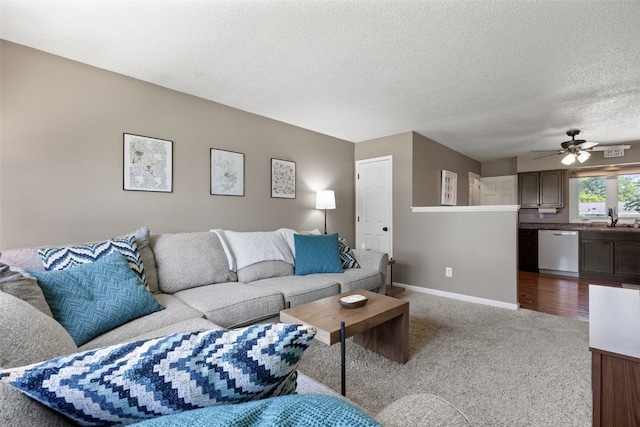 2985 4th St, Marion, IA 52302 - living area featuring carpet, a textured ceiling, ceiling fan, and baseboards