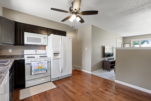 2985 4th St, Marion, IA 52302 - kitchen with white appliances, wood finished floors, a ceiling fan, baseboards, and a textured ceiling