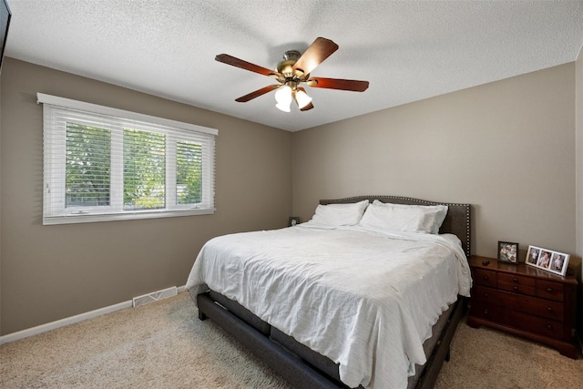 2985 4th St, Marion, IA 52302 - bedroom featuring carpet flooring, a ceiling fan, baseboards, and a textured ceiling