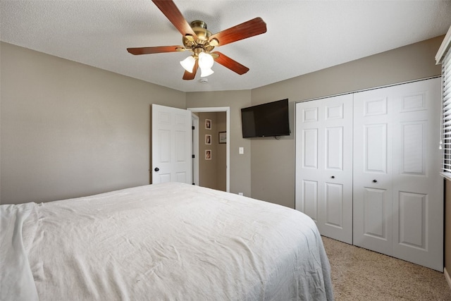 2985 4th St, Marion, IA 52302 - bedroom featuring light carpet, a closet, and a ceiling fan