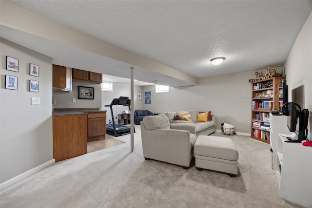 2985 4th St, Marion, IA 52302 - living area with a textured ceiling, light carpet, and baseboards