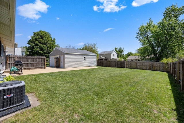 2985 4th St, Marion, IA 52302 - view of yard featuring a patio area, central AC unit, and an outbuilding