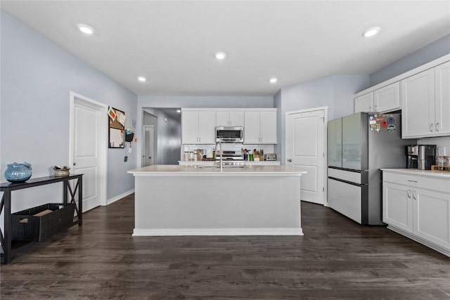 2890 Meadow Ct, Hiawatha, IA 52233 - kitchen featuring appliances with stainless steel finishes, white cabinetry, backsplash, light countertops, and dark wood-type flooring