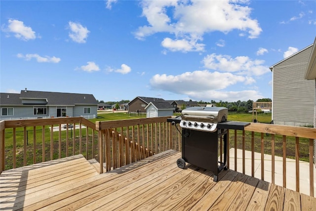 2890 Meadow Ct, Hiawatha, IA 52233 - wooden deck featuring a residential view, a grill, and a lawn