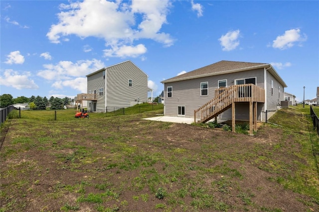 2890 Meadow Ct, Hiawatha, IA 52233 - back of property featuring stairs, a wooden deck, and a patio area