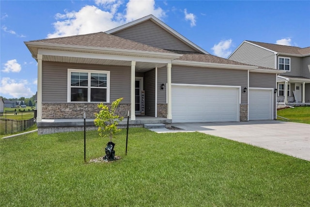 2890 Meadow Ct, Hiawatha, IA 52233 - view of front of home with a garage, driveway, a front lawn, covered porch, and stone siding