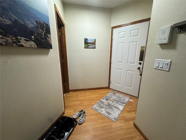 4610 Westchester Dr NE Unit A, Cedar Rapids, IA 52402 - entrance foyer with light wood-style floors and baseboards