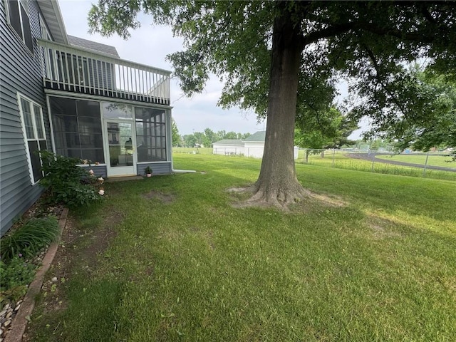 4610 Westchester Dr NE Unit A, Cedar Rapids, IA 52402 - view of yard with a sunroom and a balcony