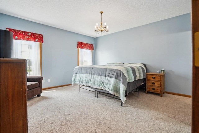 4610 Westchester Dr NE Unit A, Cedar Rapids, IA 52402 - carpeted bedroom featuring multiple windows, a chandelier, baseboards, and a textured ceiling