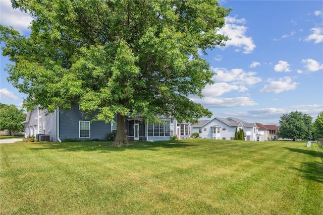 4610 Westchester Dr NE Unit A, Cedar Rapids, IA 52402 - view of green lawn with central AC