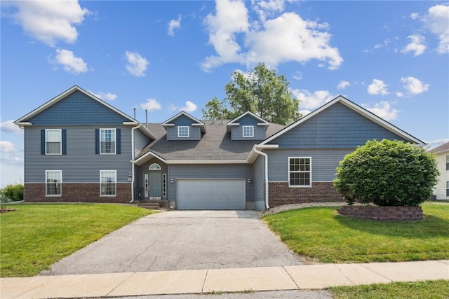 4610 Westchester Dr NE Unit A, Cedar Rapids, IA 52402 - view of front of home featuring asphalt driveway, brick siding, a front lawn, and a garage