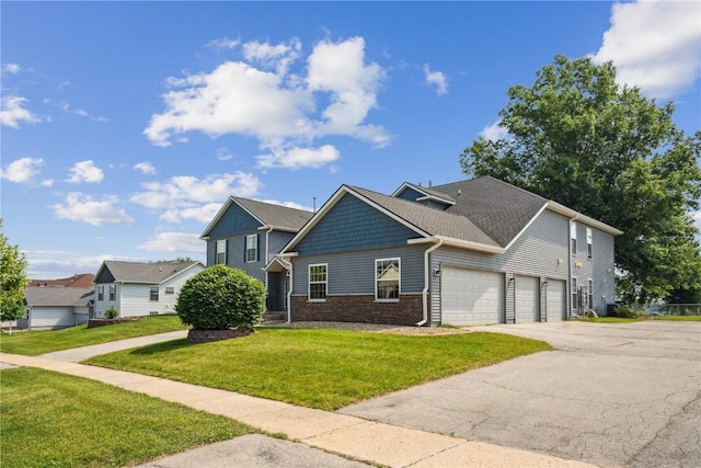 4610 Westchester Dr NE Unit A, Cedar Rapids, IA 52402 - view of front of house with brick siding, a front yard, a garage, and driveway