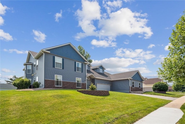 4610 Westchester Dr NE Unit A, Cedar Rapids, IA 52402 - view of front facade with a front lawn, brick siding, a garage, and concrete driveway