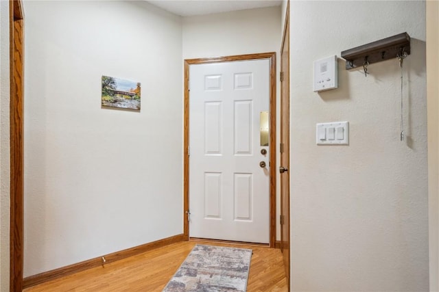 4610 Westchester Dr NE Unit A, Cedar Rapids, IA 52402 - foyer entrance featuring light wood-style flooring and baseboards
