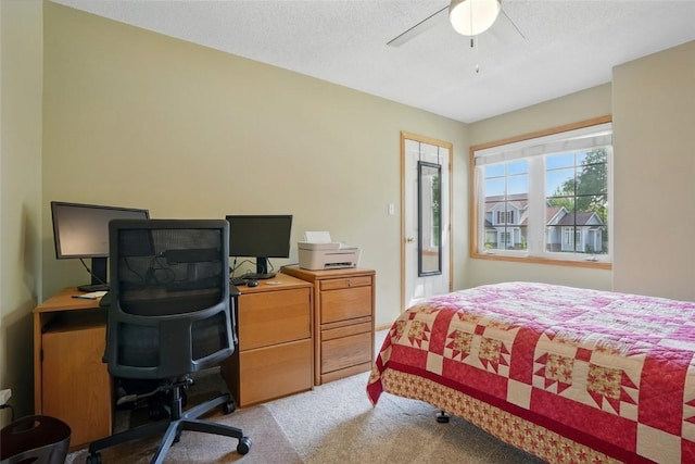 7025 Walden Rd NE, Cedar Rapids, IA 52402 - carpeted bedroom featuring an office area, a ceiling fan, and a textured ceiling