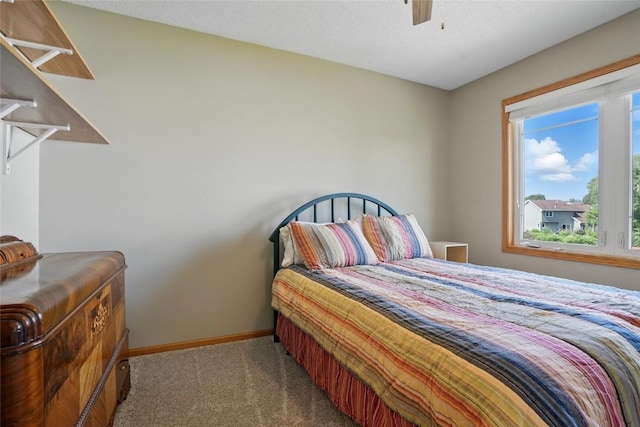 7025 Walden Rd NE, Cedar Rapids, IA 52402 - bedroom with carpet flooring, baseboards, and ceiling fan