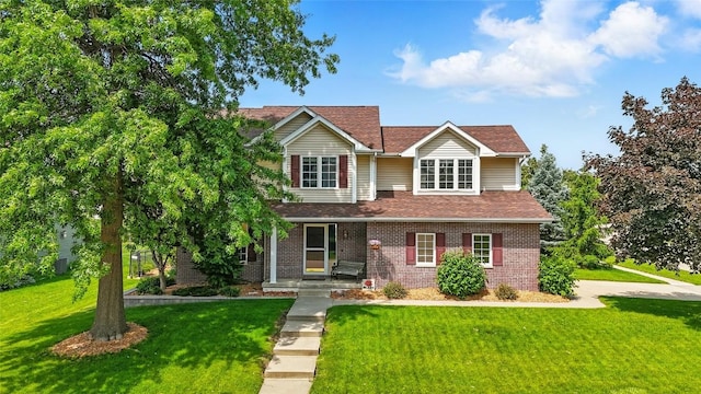 7025 Walden Rd NE, Cedar Rapids, IA 52402 - traditional-style home with brick siding, a front yard, and a shingled roof