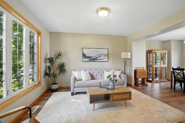7025 Walden Rd NE, Cedar Rapids, IA 52402 - living area featuring wood finished floors and baseboards