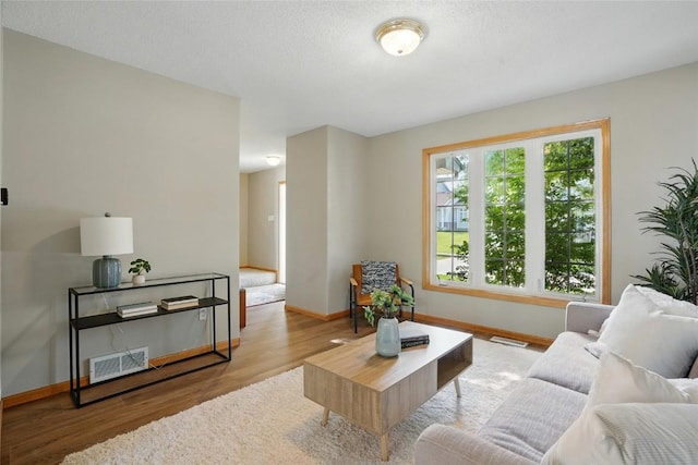 7025 Walden Rd NE, Cedar Rapids, IA 52402 - living area featuring wood finished floors and baseboards