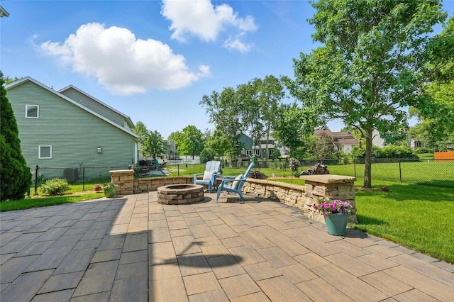 7025 Walden Rd NE, Cedar Rapids, IA 52402 - view of patio featuring a fire pit