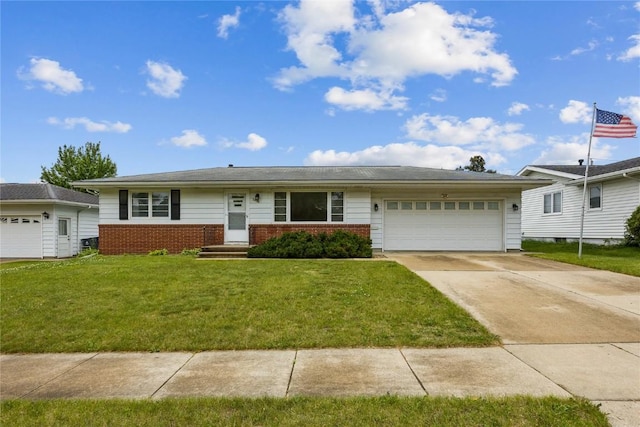 2430 Victoria Dr SW, Cedar Rapids, IA 52404 - single story home with brick siding, a front yard, an attached garage, and concrete driveway
