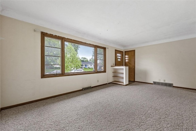 2430 Victoria Dr SW, Cedar Rapids, IA 52404 - carpeted empty room with baseboards