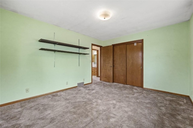2430 Victoria Dr SW, Cedar Rapids, IA 52404 - unfurnished bedroom featuring carpet flooring, baseboards, and a closet