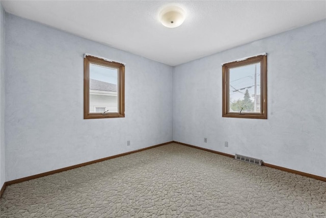 2430 Victoria Dr SW, Cedar Rapids, IA 52404 - carpeted empty room featuring baseboards