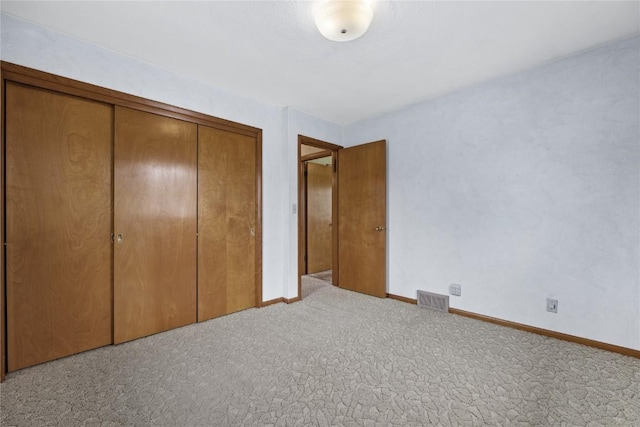 2430 Victoria Dr SW, Cedar Rapids, IA 52404 - unfurnished bedroom featuring carpet floors, a closet, and baseboards