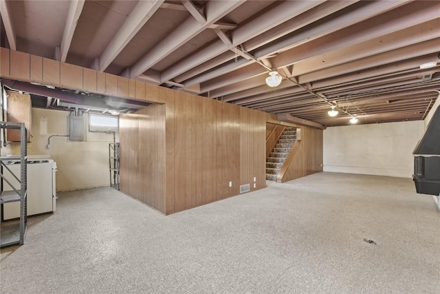 2430 Victoria Dr SW, Cedar Rapids, IA 52404 - basement featuring stairway, electric panel, and wooden walls
