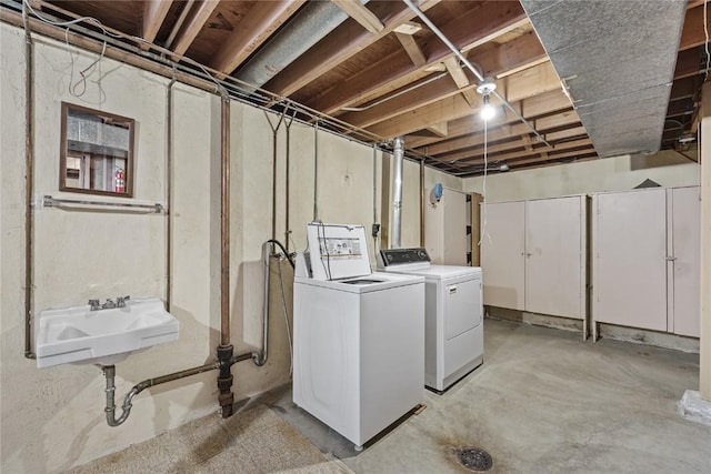 2430 Victoria Dr SW, Cedar Rapids, IA 52404 - unfinished below grade area featuring washer and clothes dryer and a sink