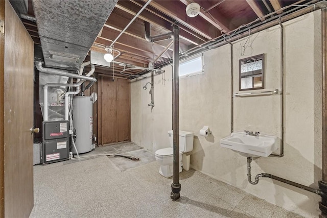 2430 Victoria Dr SW, Cedar Rapids, IA 52404 - basement with water heater, a sink, and tile patterned floors