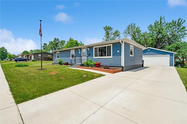 1026 Eisenhower Rd, Hiawatha, IA 52233 - ranch-style house featuring an outbuilding, a detached garage, and a front lawn