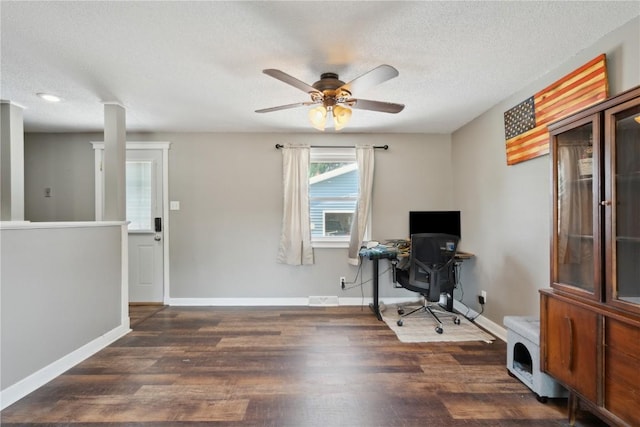 1026 Eisenhower Rd, Hiawatha, IA 52233 - office area featuring ceiling fan, dark wood-style floors, baseboards, and a textured ceiling