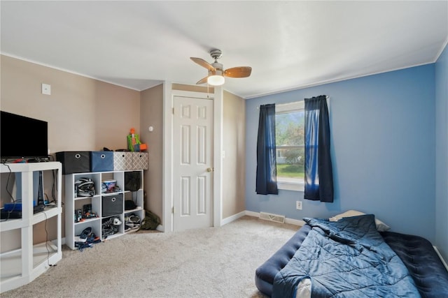 1026 Eisenhower Rd, Hiawatha, IA 52233 - bedroom with carpet flooring, ceiling fan, and baseboards